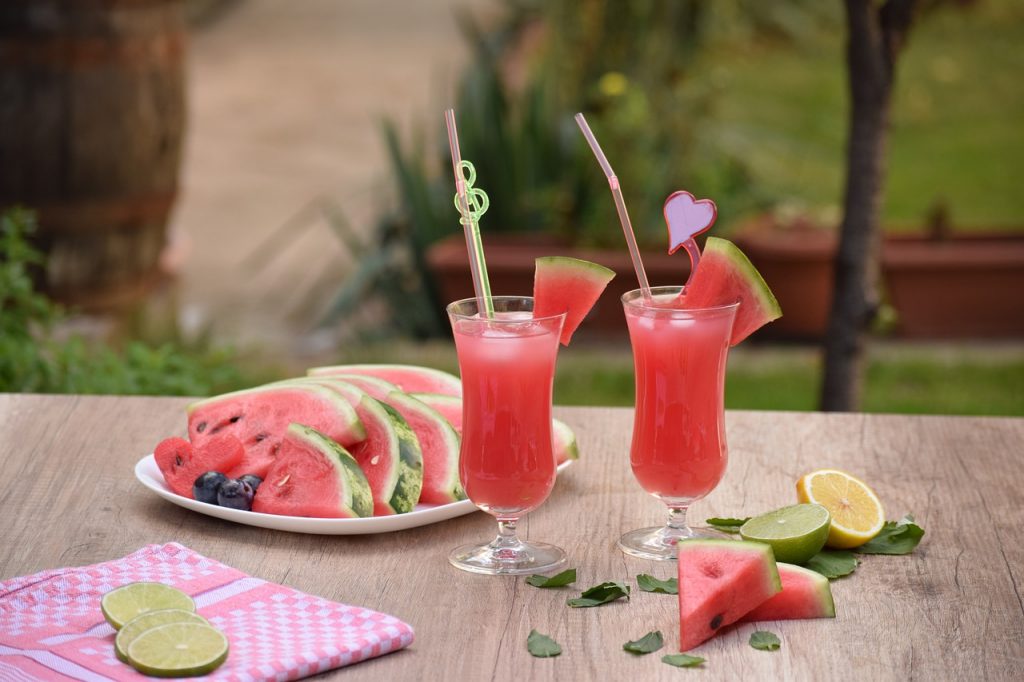 outdoor table with two cocktail drinks